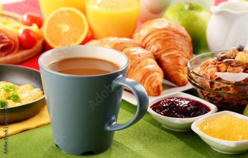 Breakfast served with coffee, juice, egg, and rolls