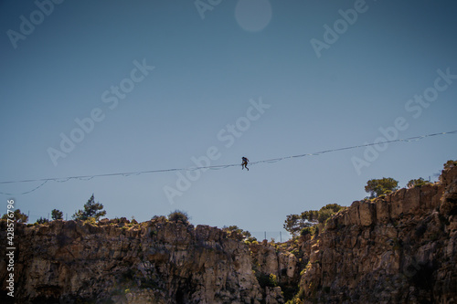 Acrobatics on a tightrope over a crater 55meters high at Lavrio, Greece
