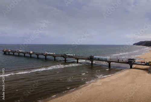 Mi  dzyzdroje 04 17 2021 Beach on the Baltic Sea  northwestern Poland  pier by the sea