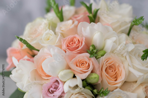 Delicate blossoming roses and blooming flowers festive background  pastel and soft bouquet floral card  selective focus.