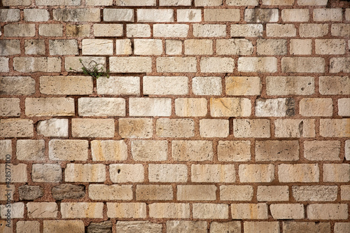 Old wall built of brick and stone  historic background