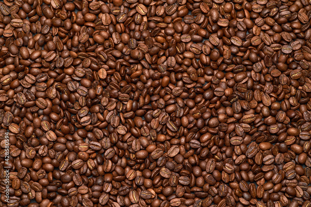 Background or texture made of roasted brown coffee beans Background or texture made of roasted brown coffee beans