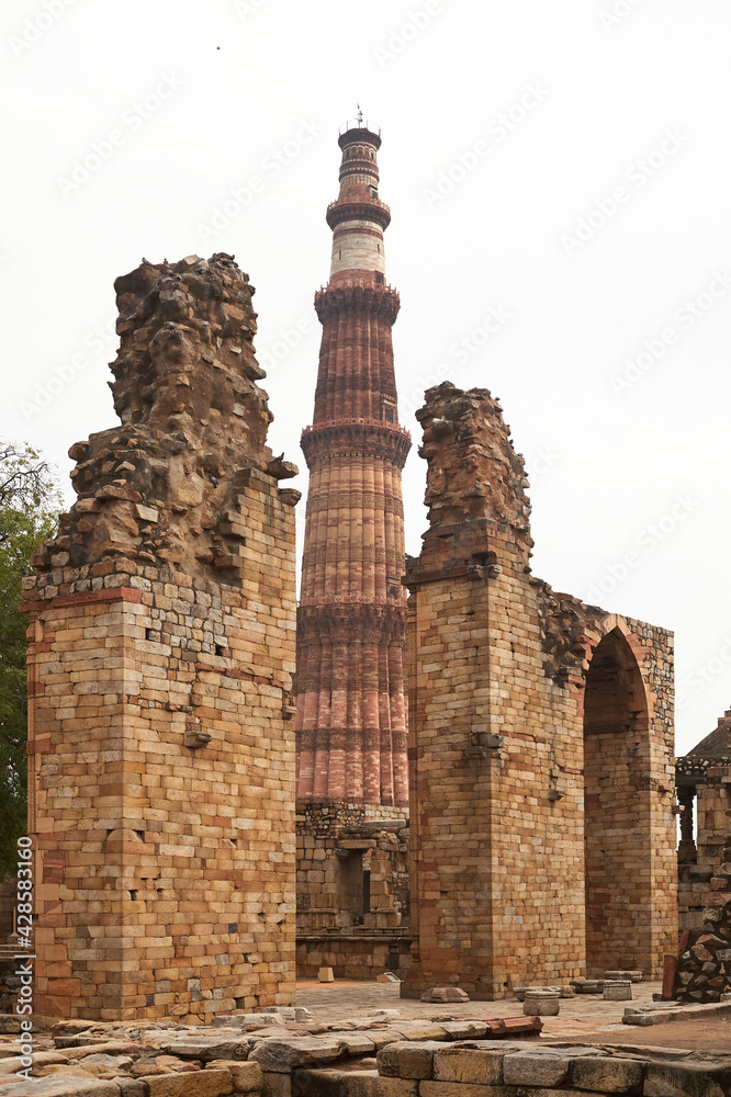 The Qutb Minar is a victory tower, watchtower and minaret in the Qutb complex in Delhi. Daylight. Eye-level. Eye-level. 