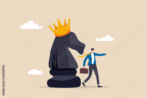 Strategy to win business competition, leadership to make decision, business challenge or tactic to overcome obstacle concept, smart businessman pointing finger to direct chess knight with king crown.