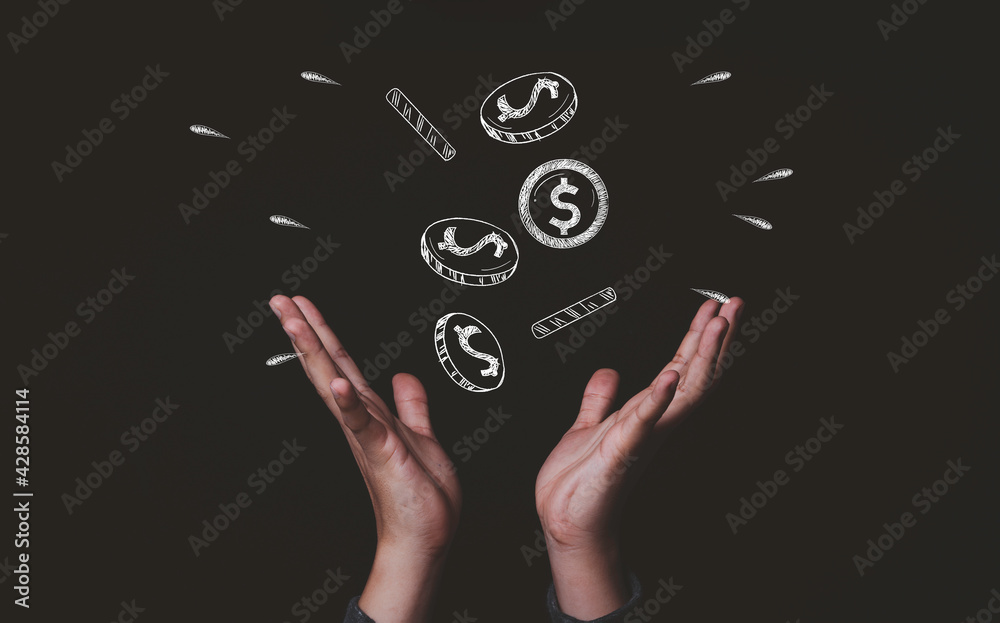 Two hands receive dollar money coins drawing which fallen from sky , Making money and business wealth concept. Two hands receive dollar money coins drawing which fallen from sky , Making money and business wealth concept.