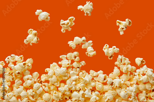 Fényképezés Popcorn On Orange Background