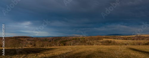 Sunset near Spicak hill in Krusne mountains in north Bohemia in winter day