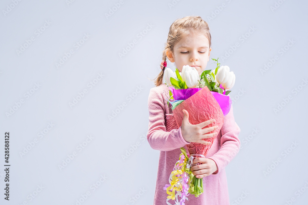 beautiful little girl with a bouquet of white tulips beautiful little girl with a bouquet of white tulips
