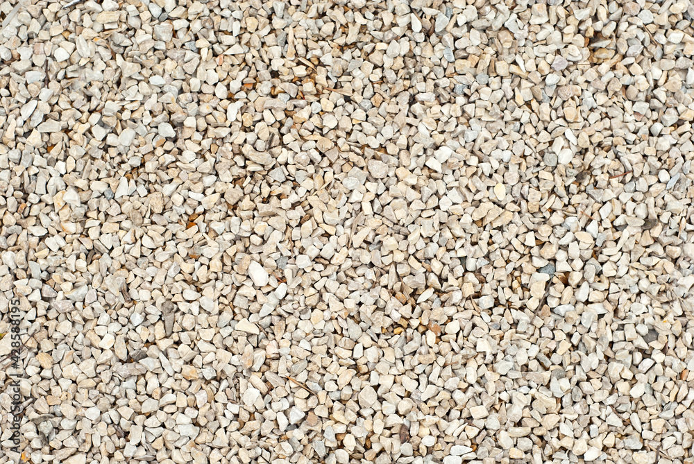 Drainage systems from small pebbles. Garden drainage for plants and trees. Yellow stones for roads and flower beds.