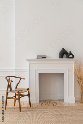 a bright space with white walls, high ceilings and wooden floors.