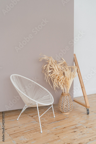 a bright space with white walls, high ceilings and wooden floors.