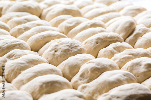 Raw bread dough close up. Preparation of bread at bakery.