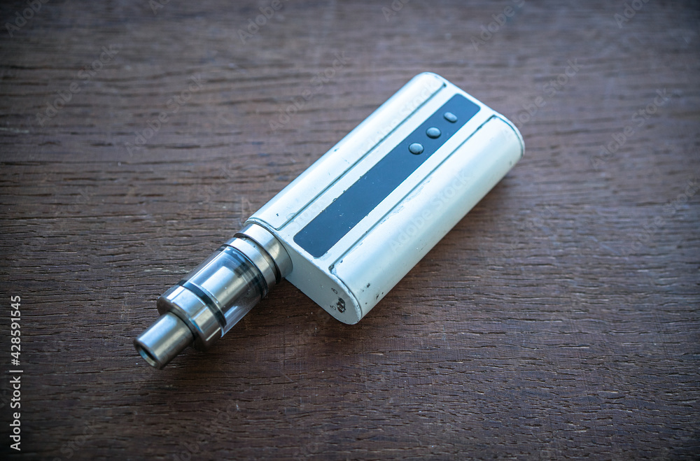 Naklejka premium Vape device for smoking liquid through an electronic cigarette