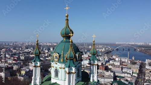 View of the roof of the St. Andrew's Church in Kyiv, Ukraine on the historical downtown background