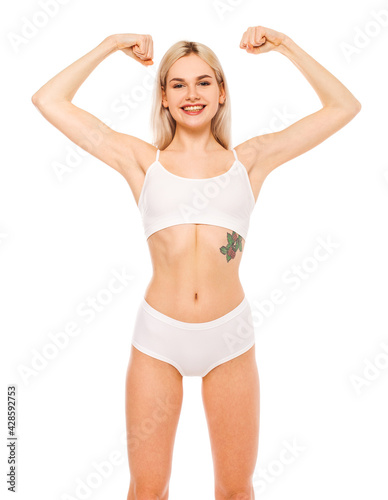 Beautiful blonde girl in sports underwear isolated on white background