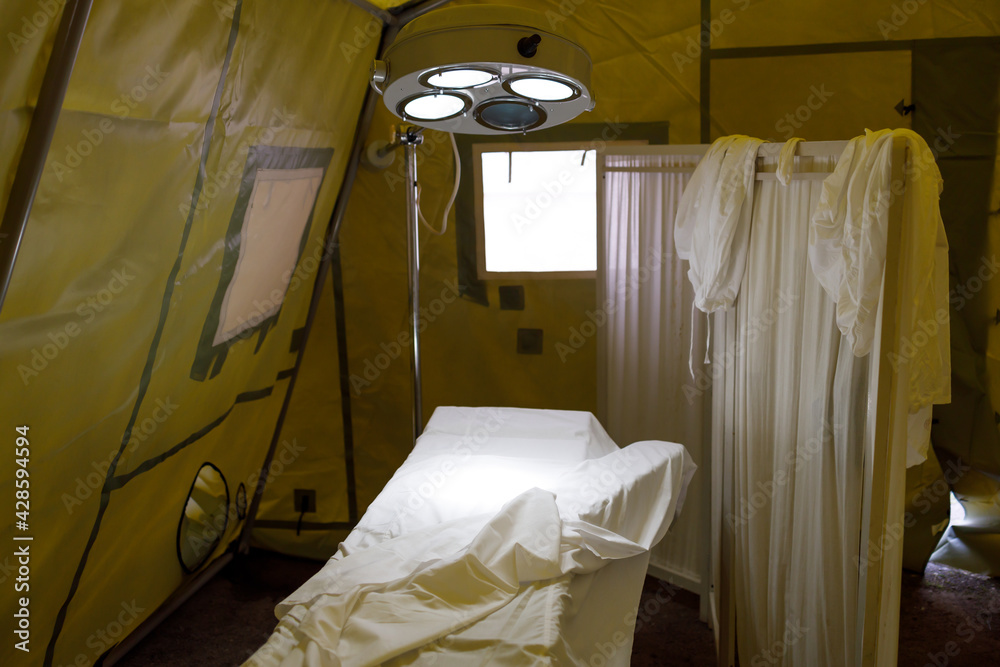 lighting device above the surgical table in a military field hospital lighting device above the surgical table in a military field hospital