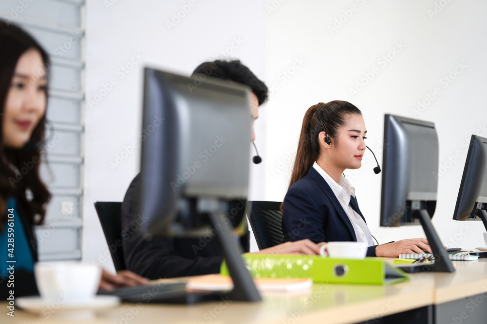 Working of young adult asian woman call center business department. Working of young adult asian woman call center business department.