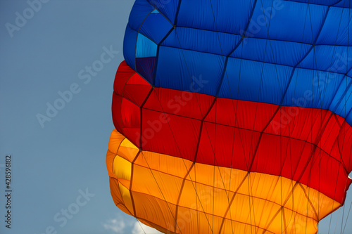 Details of bright multi-colored parachute canopy, close-up.