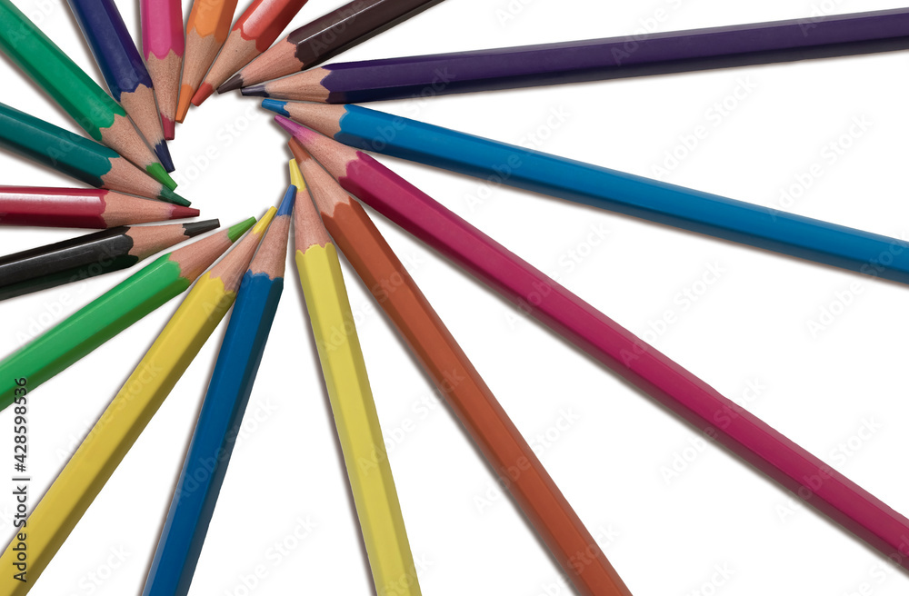 Multi-colored pencils lying on a white isolated background in a circle close-up Multi-colored pencils lying on a white isolated background in a circle close-up