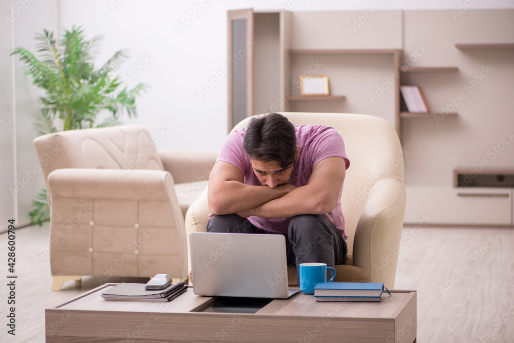 Young man working from home during pandemic Young man working from home during pandemic