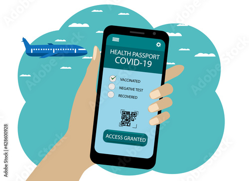Phone in hand. On the screen, the application is health passport covid 19