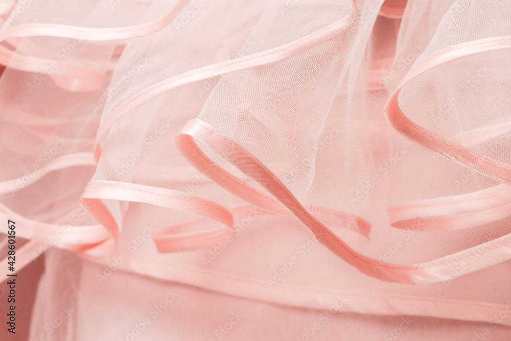 Wedding dress detail. Pink wedding dress frills close up.