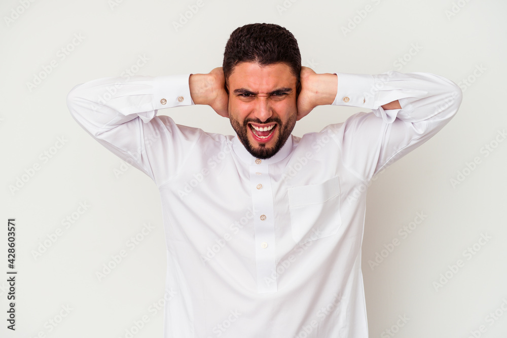 Young arab man wearing typical arab clothes isolated on white background Young arab man wearing typical arab clothes isolated on white background