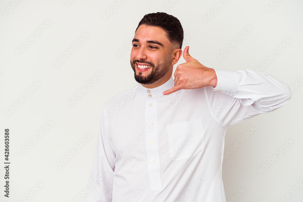 Young arab man wearing typical arab clothes isolated on white background Young arab man wearing typical arab clothes isolated on white background