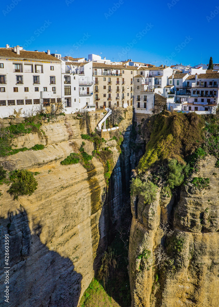 View from the Puente Nuevo on El Tajo, a deep canyon splitting the town of Ronda into two (Andalusia Spain)