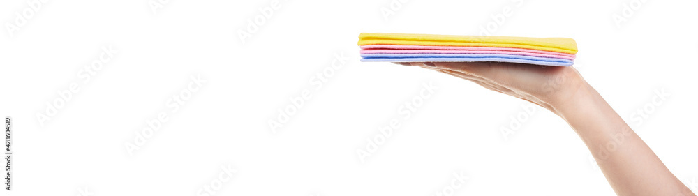 Hand with colored cleaning rag isolated on white background. Hand with colored cleaning rag isolated on white background.
