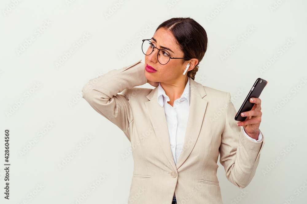 Young business woman holding a mobile phone isolated on white background Young business woman holding a mobile phone isolated on white background