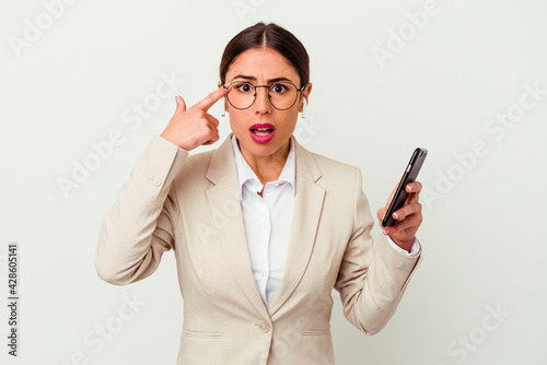 Young business woman holding a mobile phone isolated on white background