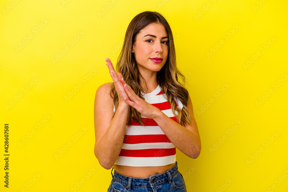 Young caucasian woman isolated on yellow background Young caucasian woman isolated on yellow background