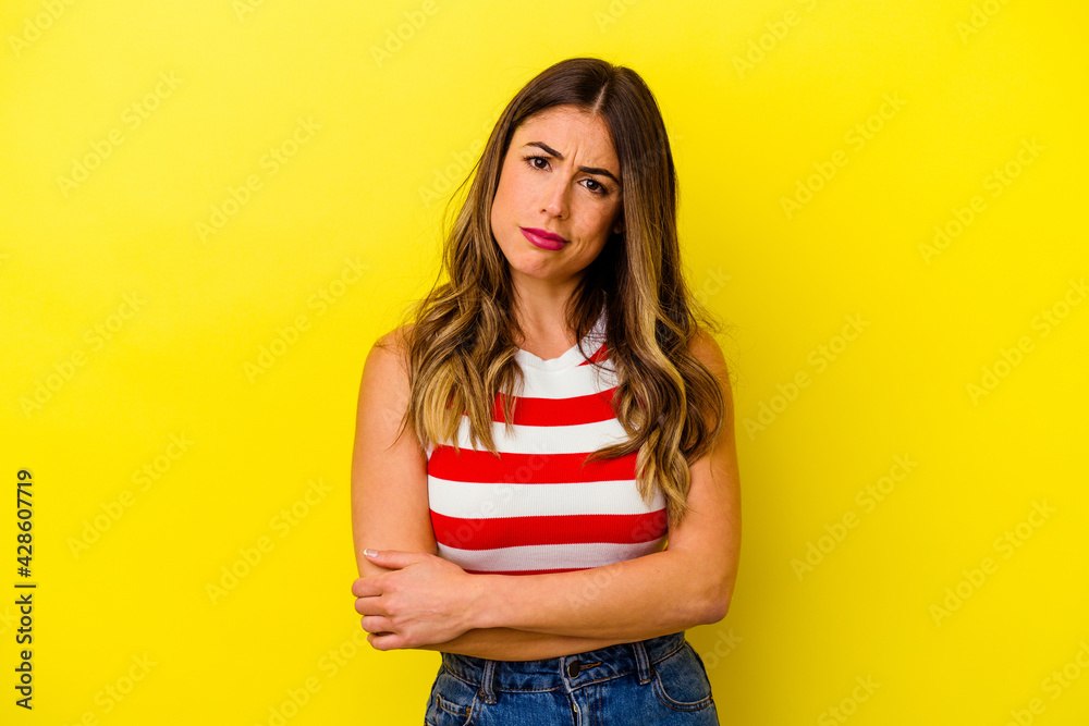 Young caucasian woman isolated on yellow background Young caucasian woman isolated on yellow background