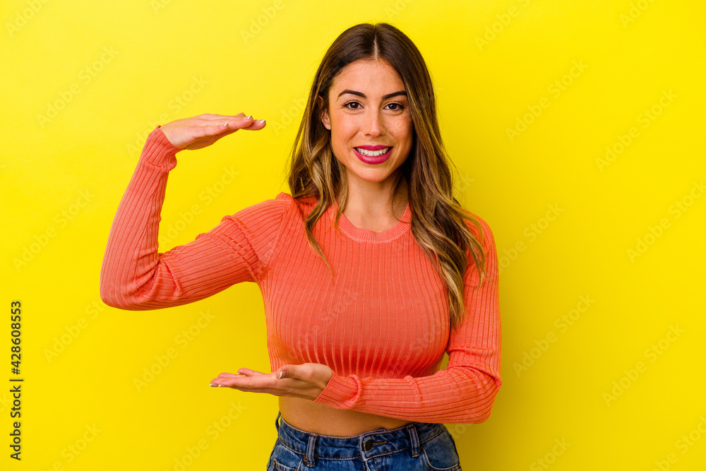 Young caucasian woman isolated on yellow background Young caucasian woman isolated on yellow background