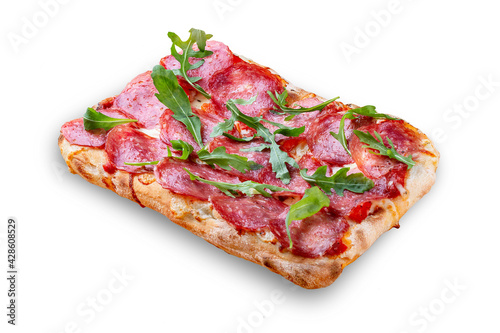 Salami pizza, bell pepper, rucola, kalamata, pesto, parmesan. Roman pizza rectangular on white background