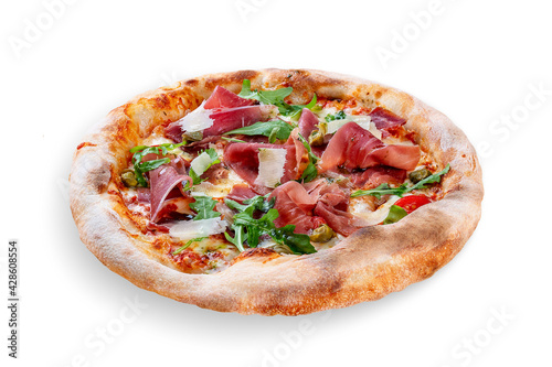 Sorrentina pizza with prosciutto, arugula, capers, pelati sauce, pesto. Neapolitan round pizza on white background