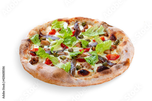 Caesar pizza with chicken, anchovies, romaine, cherry, kalamata, capers, pesto. Neapolitan round pizza on white background