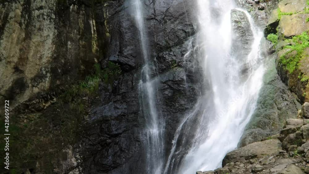 pouring water in a waterfall in the mountains of Georgia. pouring water in a waterfall in the mountains of Georgia.
