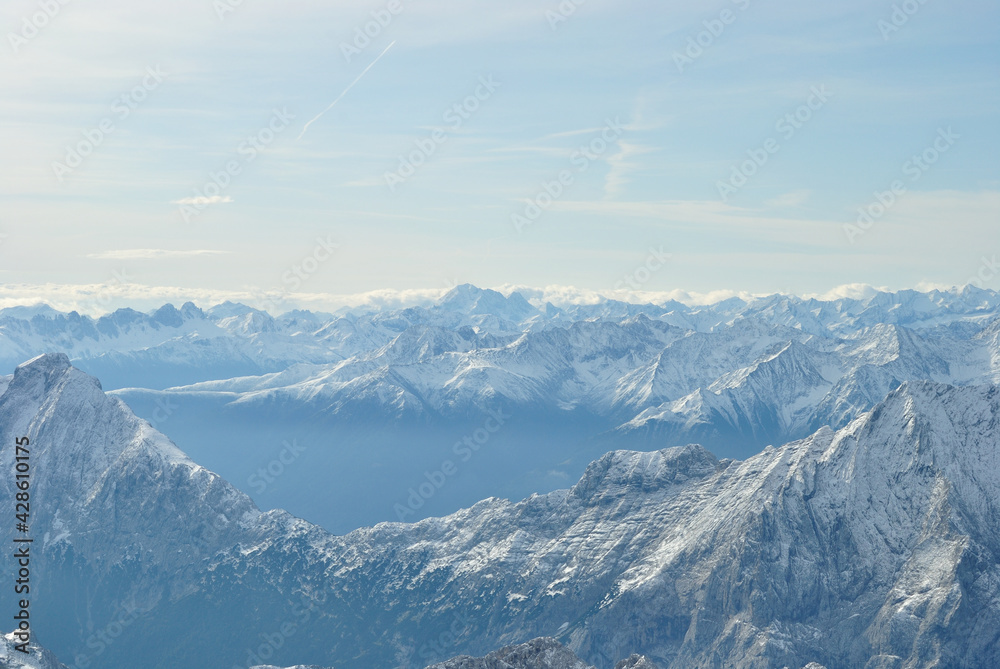 snow capped mountains in the Alps with fog
