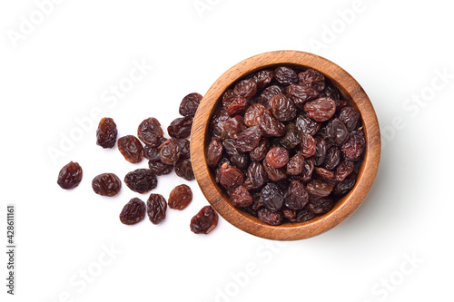 Flat lay of Raisins in wooden bowl isolated on white background. photo