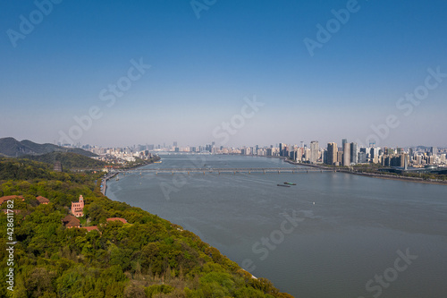 Aerial view of Qiantang River Bridge and modern city skyline in Hangzhou, China photo