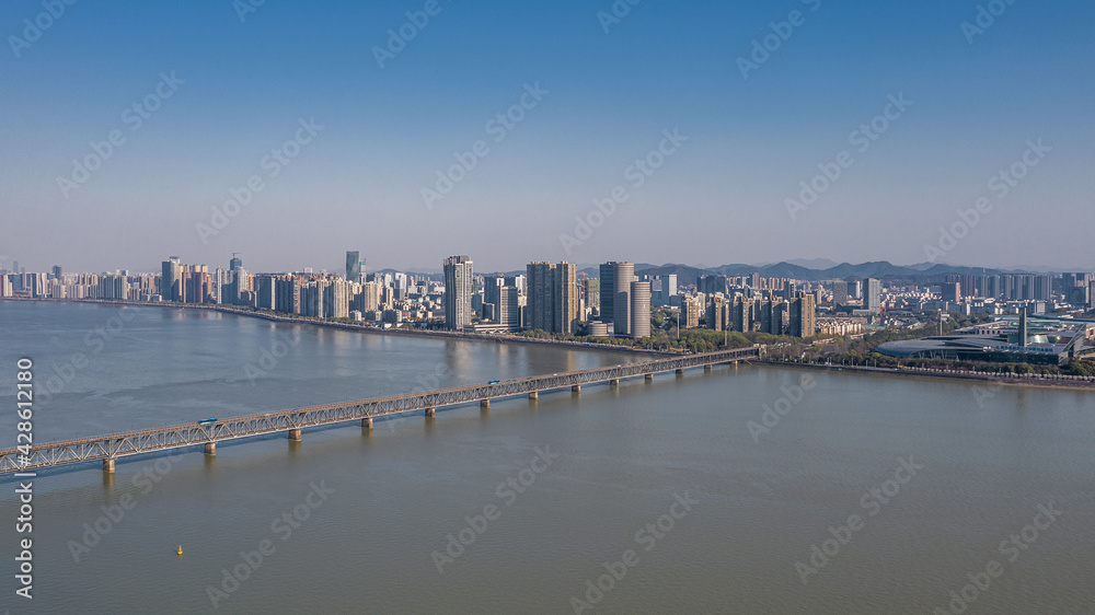 Aerial view of Qiantang River Bridge and modern city skyline in Hangzhou, China