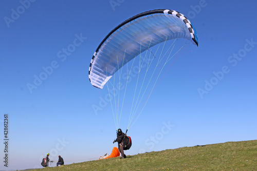 Paraglider launching at Milk Hill, Wiltshire