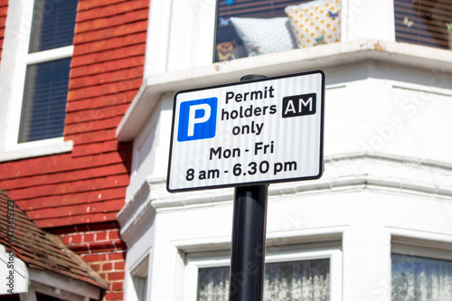 sign saying Permit holders only: Mon - Sun, 8am - 6:30pm