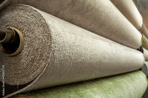 A rolls of carpet for sale in a shop store.
