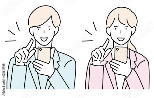 スマートフォンを操作する男女　正面