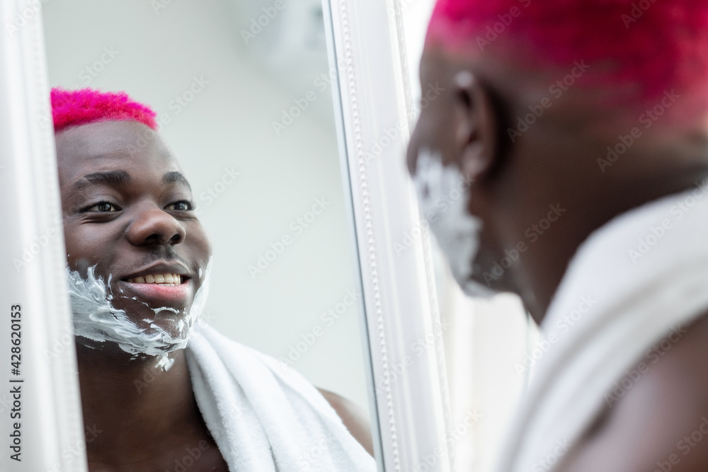 Morning grooming. Happy black man. Shaving procedure. Facial care ...
