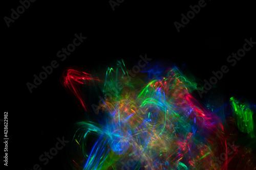 Abstract colorful blurred background on black