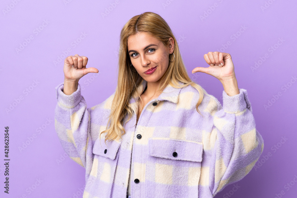 Obraz premium Young Uruguayan blonde woman over isolated background proud and self-satisfied